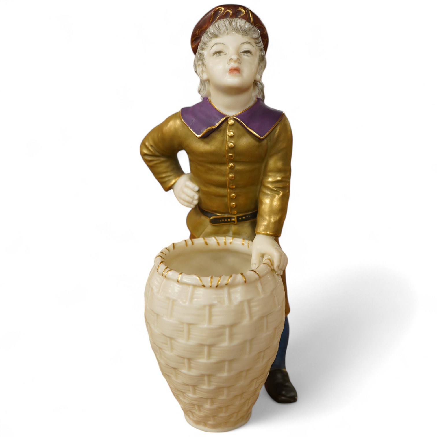 A late 19th century Royal Worcester figure of a boy with basket, 17.5cm high